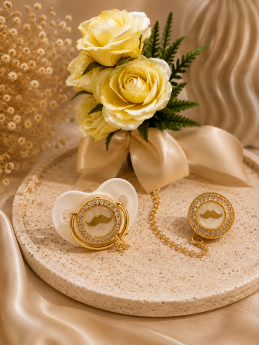 Pacifier and brooch plated