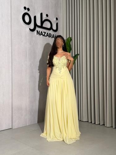 فستان سهرة أصفر ملكي بتطريز كريستال