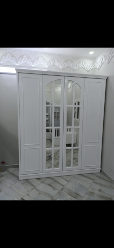 Two-meter wooden wardrobe in white color