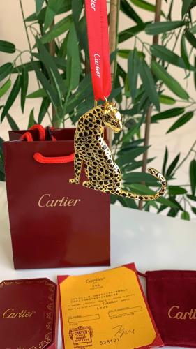 The standing tiger pendant from Cartier including accessories