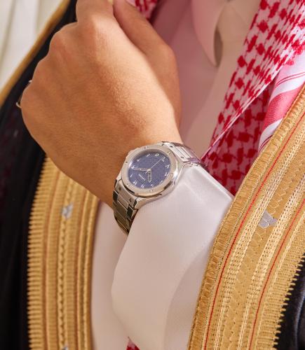 Men's watch in silver color with a blue dial, distinguished by Arabic numerals