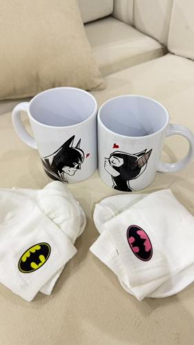 Two glass cups and socks for cables Batman and Cat...