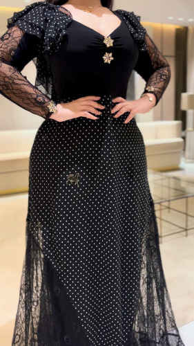 A polka dot chiffon dress lined with lace
