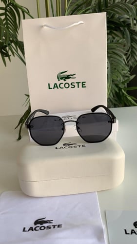 ‏نظارة لاكوست اسود مع ملحقاتها