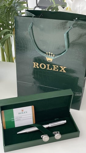 قلم وكبك رولكس فضي مع الملحقات