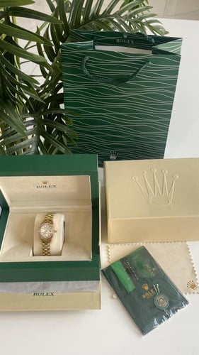 ساعه رولكس ذهبي مع ملحقاتها