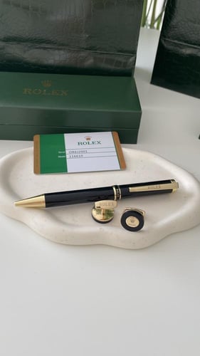 قلم وكبك رولكس اسود مع ذهبي مع الملحقات