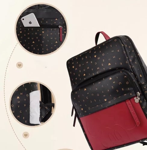 شنطة من ديزني جلد محفور عليها صورة (ميكي) او( ميني...