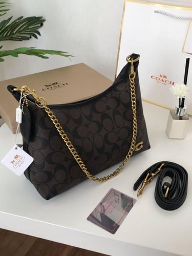 شنطة كوتش ماستر حجم وسط معا ملحقاتها