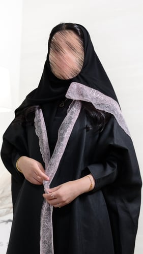 Black linen abaya – with quarter wide sleeve and pink embroidery with a headscarf.