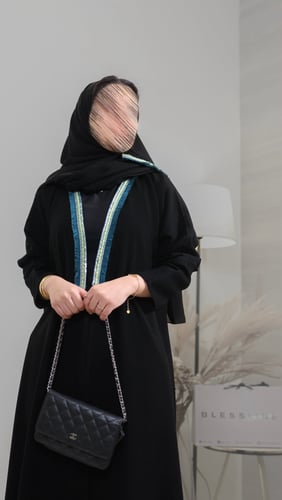Black crepe abaya – quarter wide with a distinctive collar.