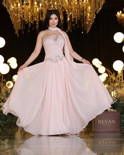 A crystal-embroidered evening dress, a sophisticated elegance from Rivan.