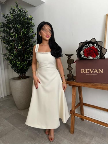 فستان عيد ميدي بفيونكة خلفية من ريڤــان