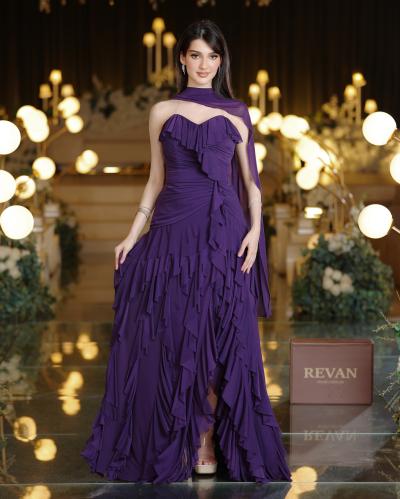 A luxurious long evening dress with ruffles from Rivan