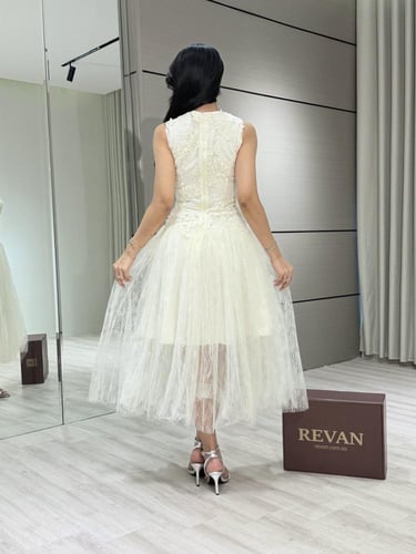 فستان عيد ميدي أنيق بتطريز ناعم من ريڤــان