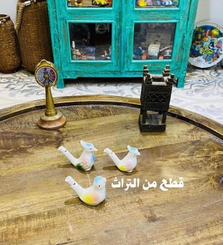 من التحف والألعاب الجميلة؛ طيور مصنوعة من السيرامي...