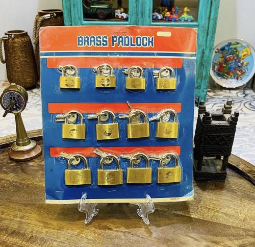 Among the distinguished items; a dozen old locks stored in the factory packaging; three different small sizes; made in Taiwan; pri...