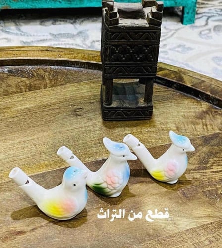 من التحف والألعاب الجميلة؛ طيور مصنوعة من السيرامي...