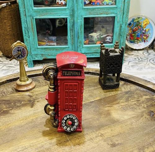 Among the distinguished items; a fibber piggy bank in the shape of a London phone