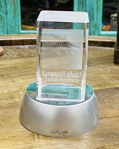 Among the distinguished items; a small-sized commemorative shield with its base from Saudi Aramco company, consisting of two piece...