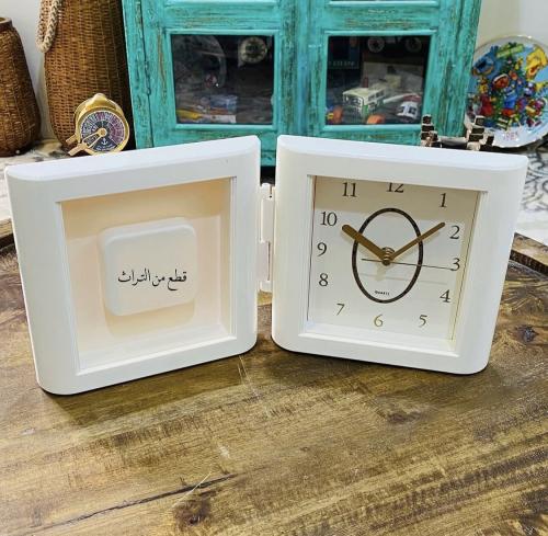 Among the distinguished items; a decorative desk clock that can be opened; with its special box