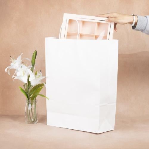 مجموعة ( 12) كيس ورق أبيض طولي الشكل بقاعدة - 31*4...