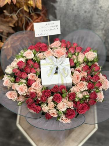 Chocolate Patchi in the middle of a bouquet of red...