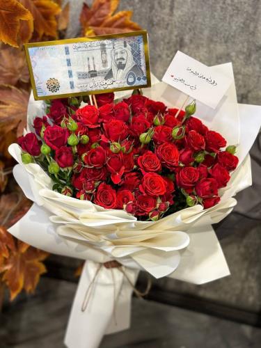 Baby Rose Red bouquet with white wrapping