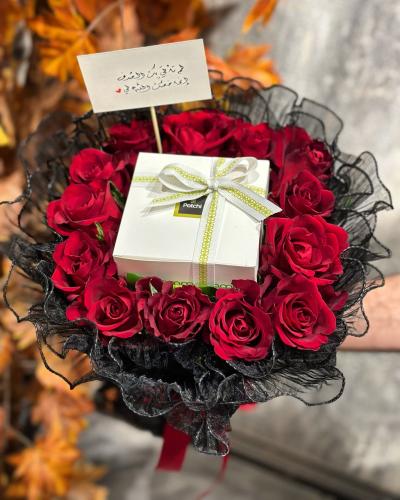 Patchi chocolate in the middle of a bouquet of red...