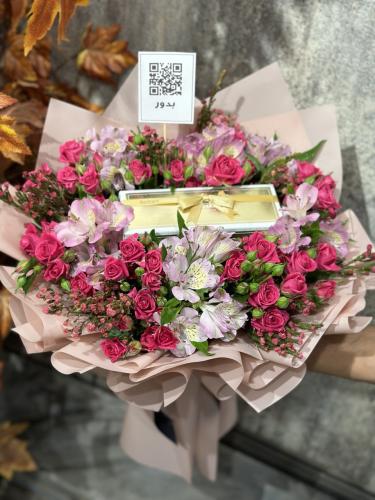 Bostani chocolate medium with a bouquet of baby ro...