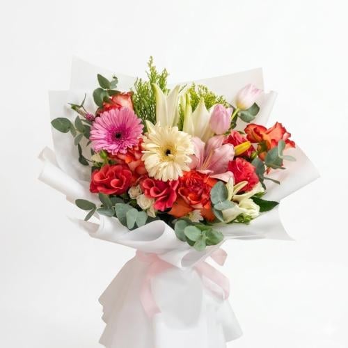 A luxurious natural flower bouquet with coral shad...