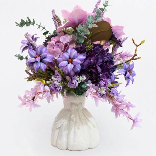 Artificial flower vase with a bright arrangement a...