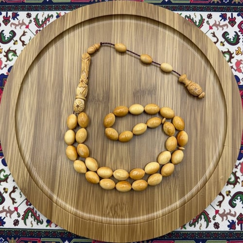 سبحة خشب الكوك بلون عسلي – 33 خرزة – شاهد وتمليكة...