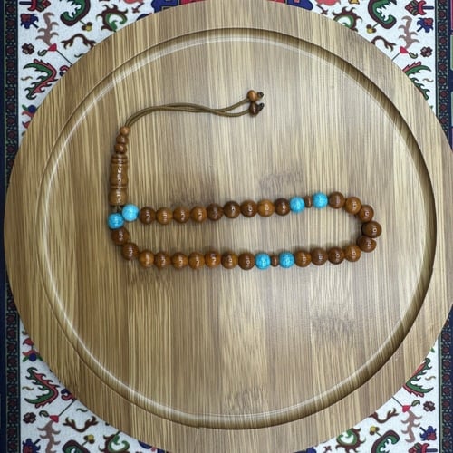 سبحة خشب الكوك مع فواصل فيروز صناعي – 33 خرزة