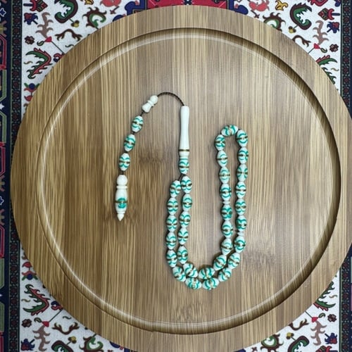 سبحة عظم الجمل مزخرفة أخضر فيروزي – خرز بيضاوي بنق...