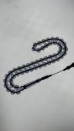 سبحة بكلايت كحلي شفاف مع كركوشة