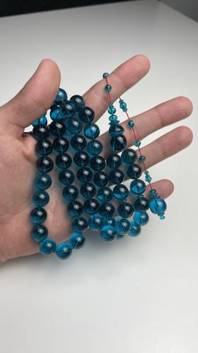 A tasbih with faceted aquamarine beads