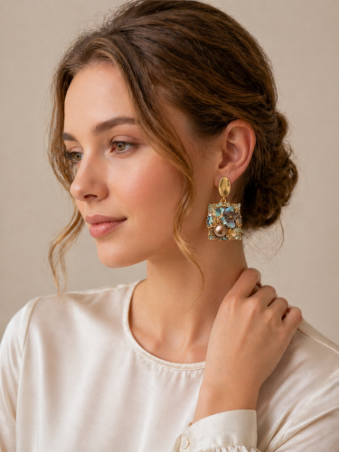 Luxurious earrings in mother-of-pearl colors and a...
