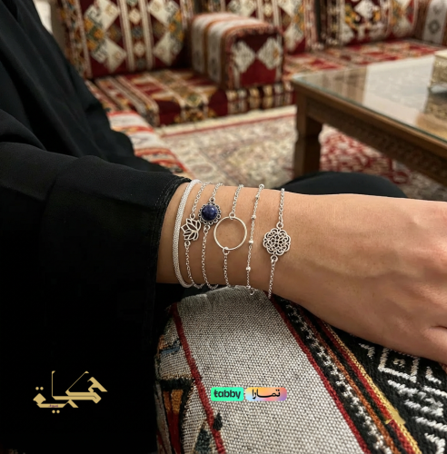 Attractive bracelets with a circular geometric design and a lotus flower.