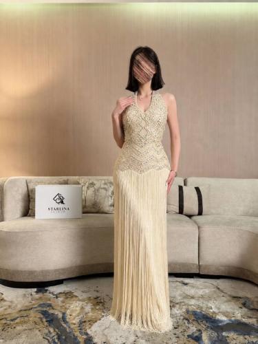 فستان سهرة عاجي بالهدب والخرز