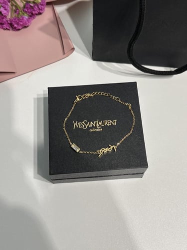 إسوارة سان لوران ذهبي