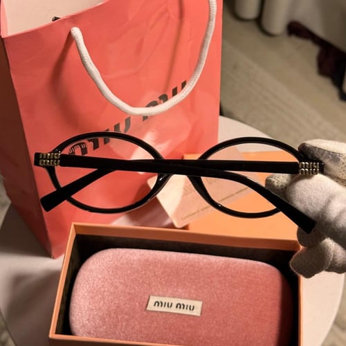 نظارة MIU MIU بيضاوي - أطار اسود عدسة شفافة
