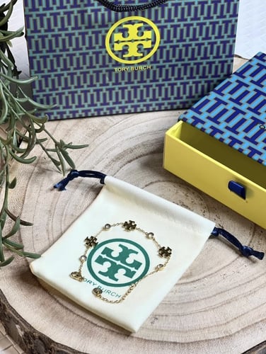 إسوارة TORY BURCH معدن ذهبي بفصوص