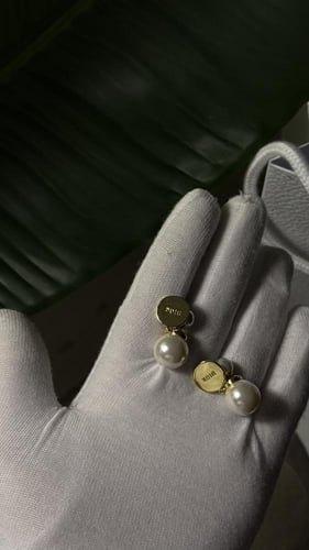 حلق Dior وردي - ازرق