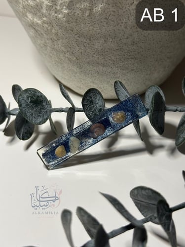 بكلات شعر مصنوعه يدوياً بمادة الريزن