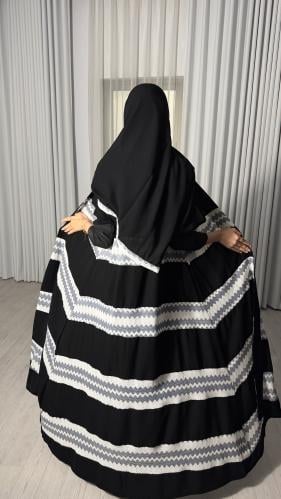 Savana abaya with its designs