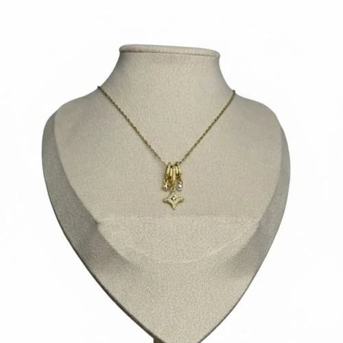 Gold necklace with a sparkling star pendant and a...