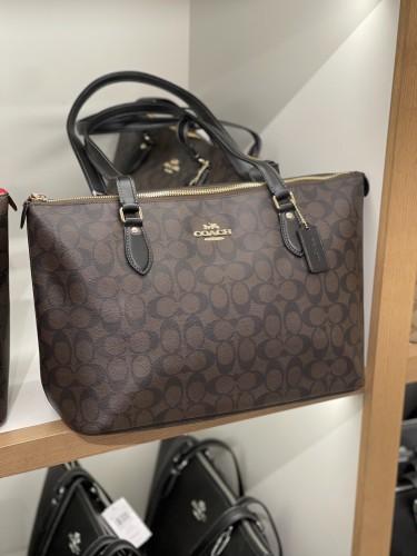 Black and brown burnt leather coach