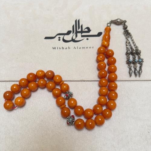 سبحة سندلوس لون مشمشي والكركوشه فضة