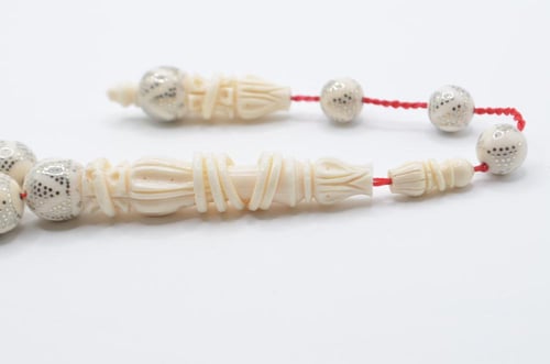 عاج ناب الفيل مطعم بالفضة